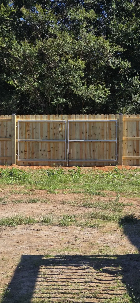 Custom double drive wood privacy gates built by Speedy Macks Fencing